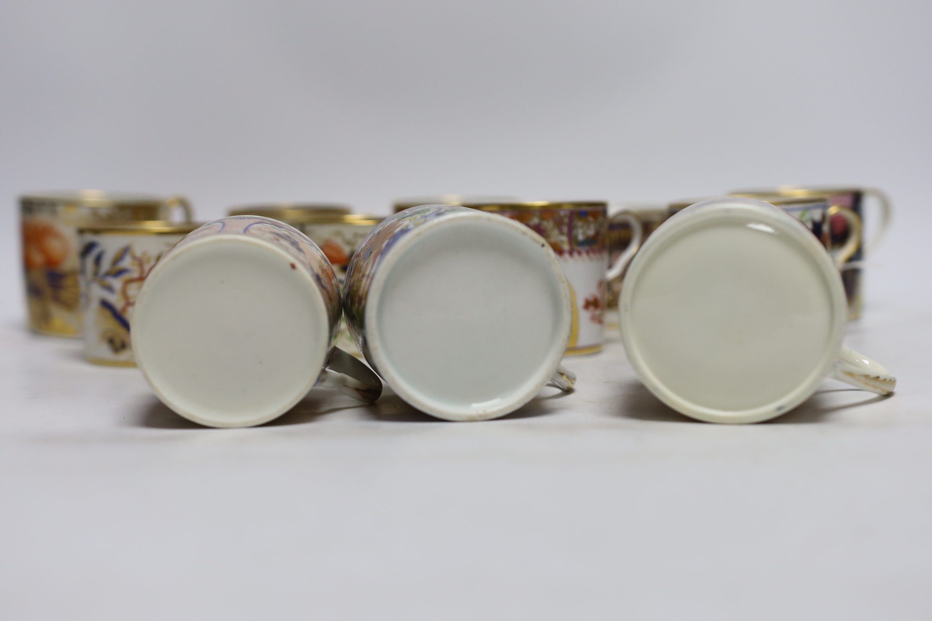 Twelve 1800-1820 English porcelain coffee cans, including Imari pattern examples